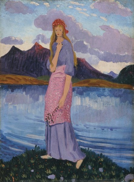 Girl standing by a lake